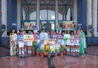 Students carrying placards to highlight the cause of "Save Earth" on the occasion of Earth Day 