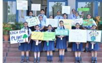 Students carrying placards to highlight the cause of "Save Earth" on the occasion of Earth Day 